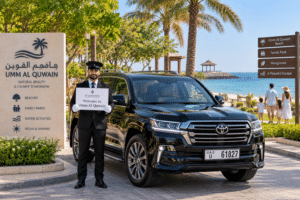 Chauffeur service Umm Al Quwain – SUV near beach and green park area
