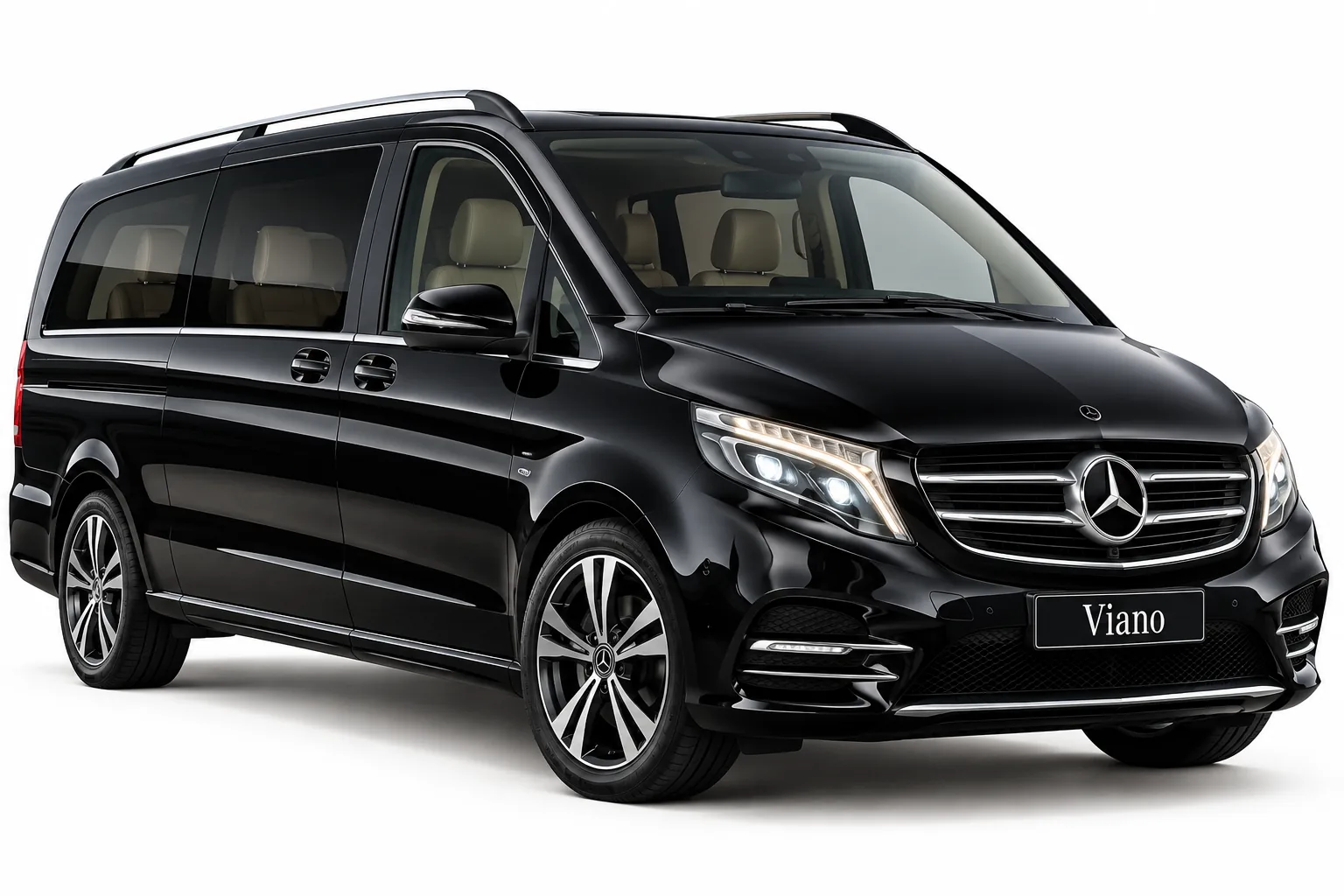 Private desert safari transfer Dubai with a luxury Mercedes Viano on a desert road at sunset
